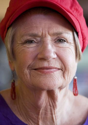 Senior woman in red hat