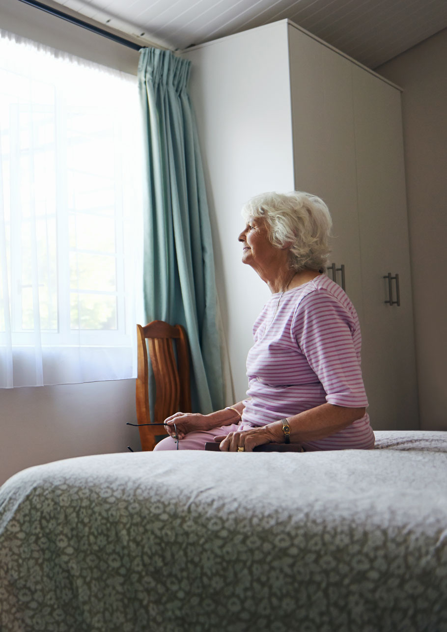 Senior woman in room alone