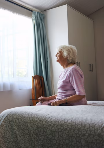 Senior woman in room alone