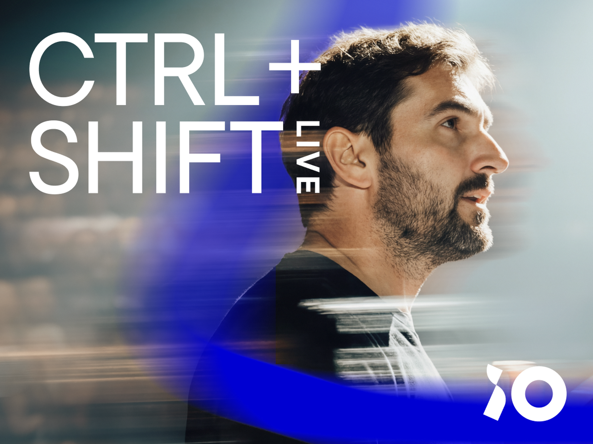 Man gazes upward amid dynamic blue streaks; text reads "CTRL + SHIFT LIVE," with a stylized "10" logo in the corner.