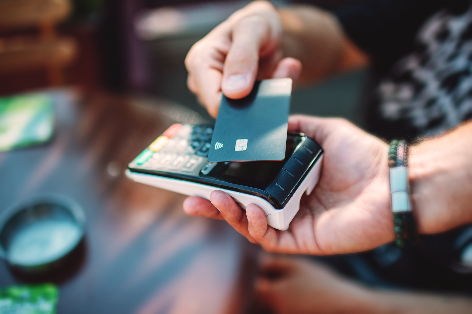 Someone paying at a mobile terminal with a card