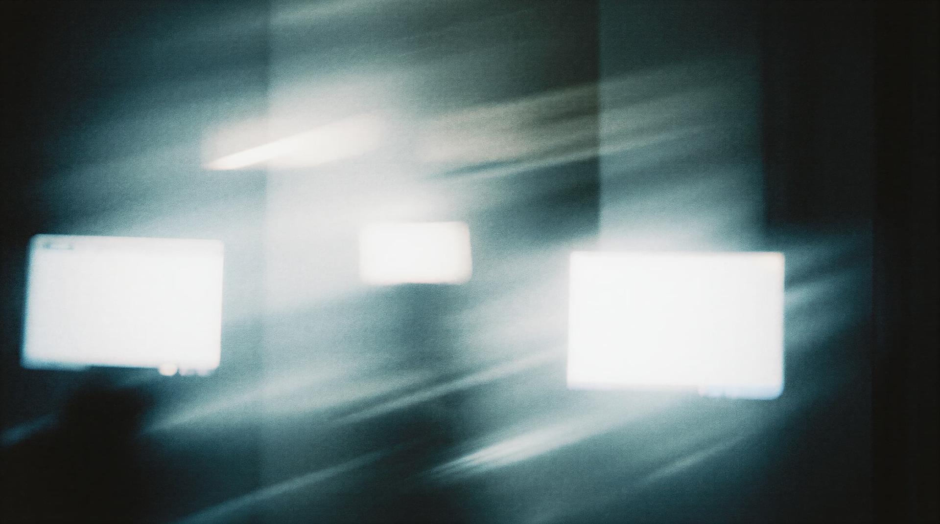 Abstract image with blurred white light squares and dark streaks, creating a dynamic, mysterious atmosphere.
