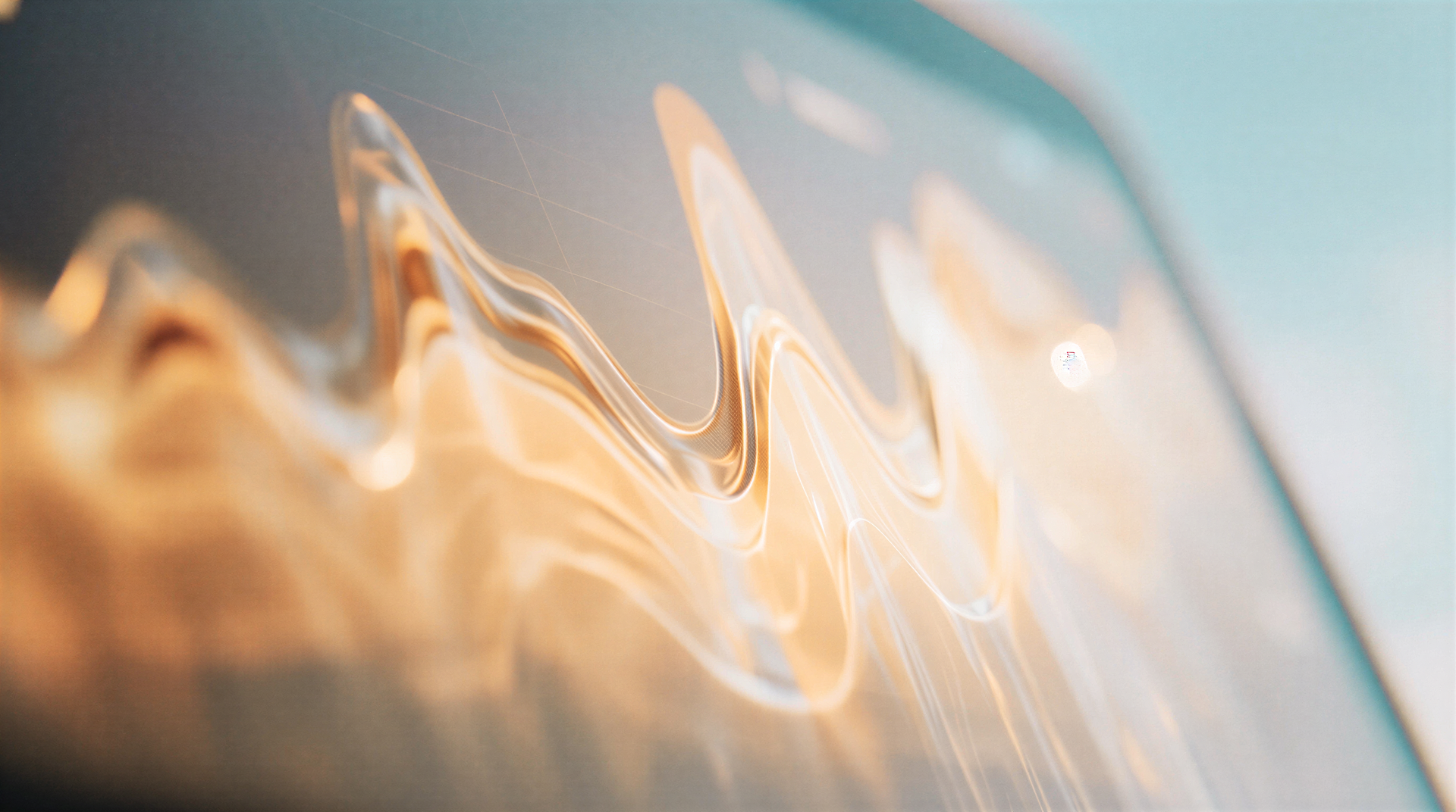Abstract close-up of a digital display showing fluid, wavy gold and white lines against a soft blue background.