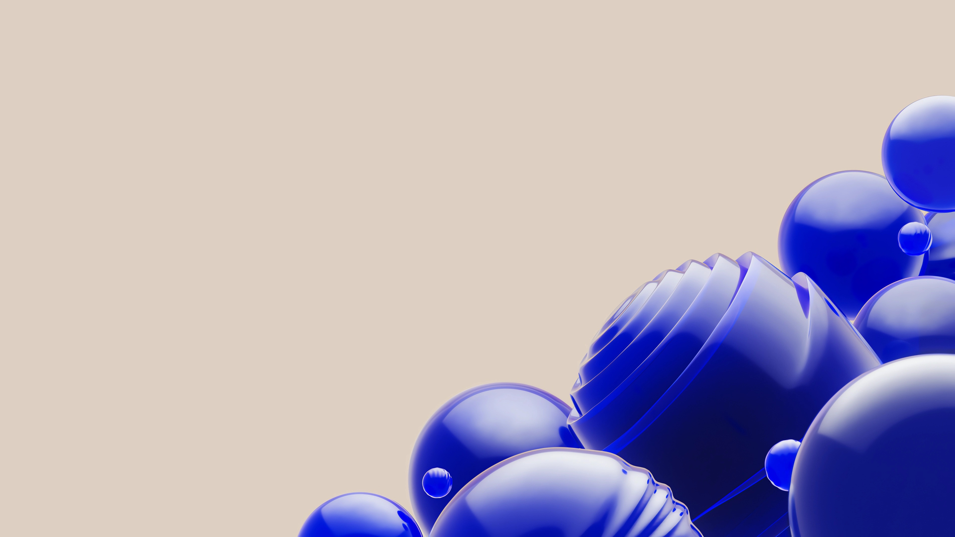 Abstract image of various-sized, glossy blue spheres clustered on a beige background, creating a modern and dynamic composition.