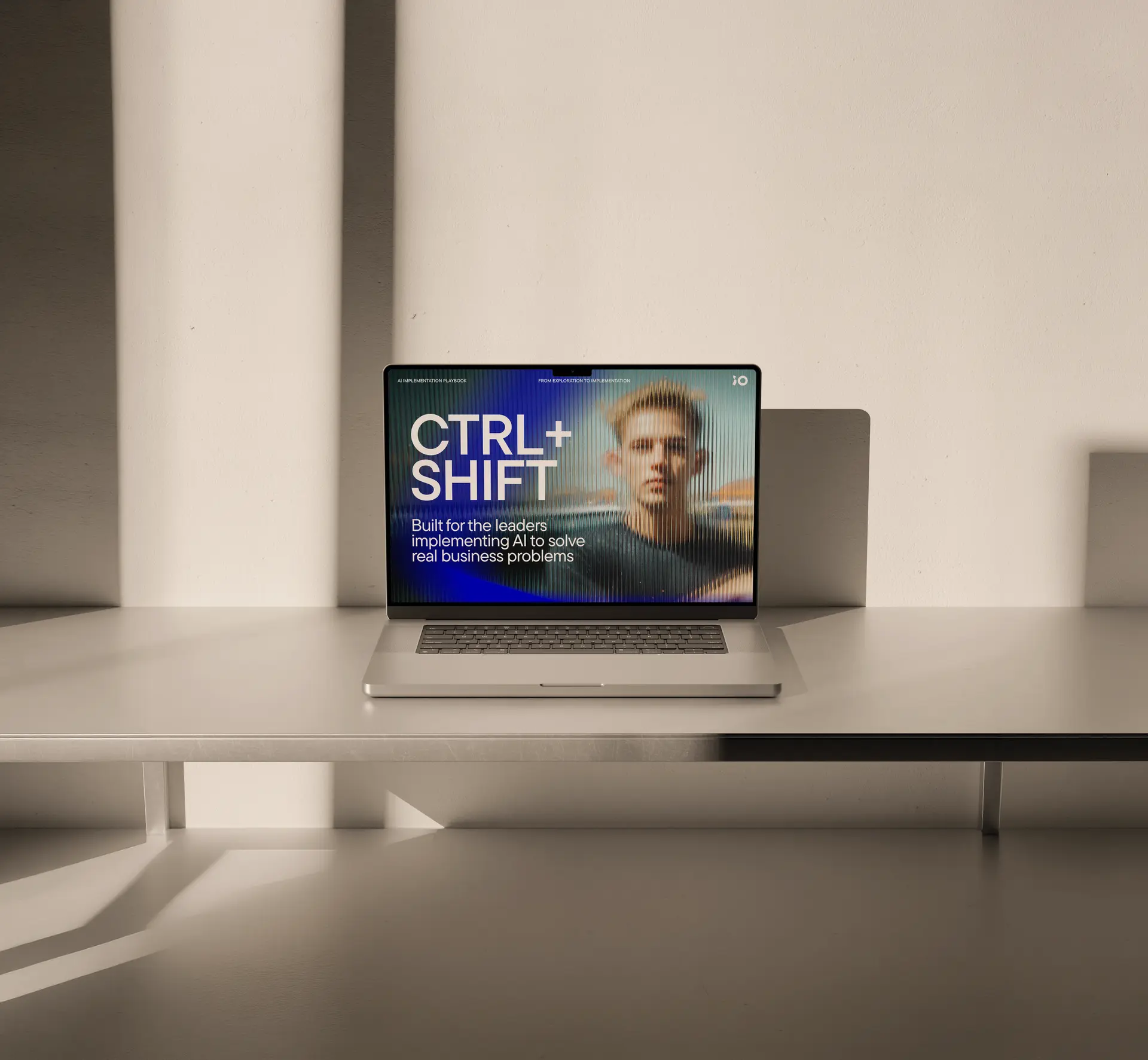 A laptop on a sleek desk displays "CTRL+SHIFT" and a blurred image with text about AI leadership in business problem-solving.