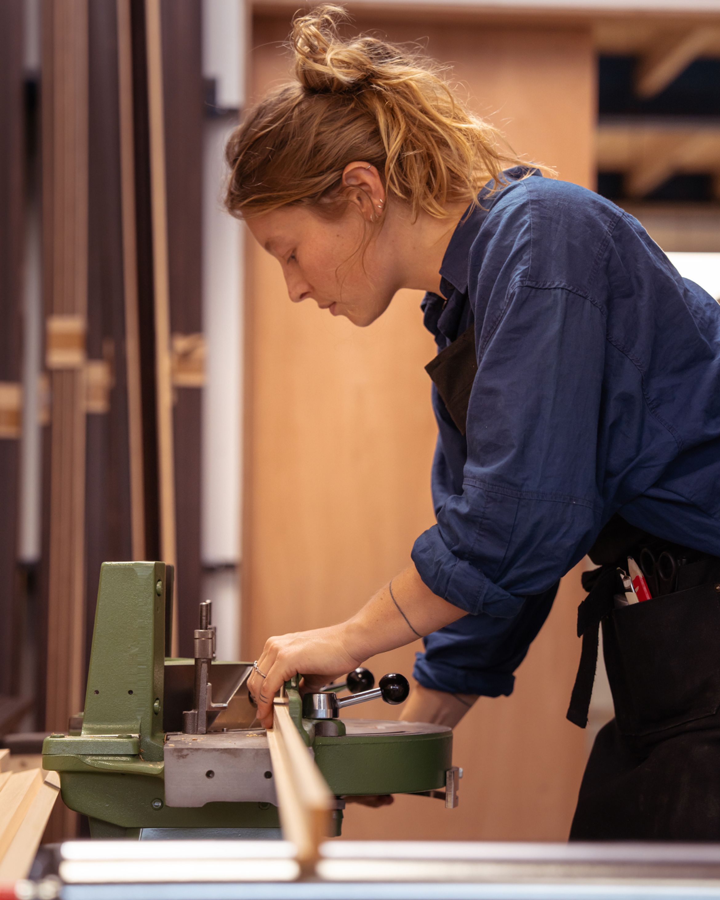 Portrait of master framer, Roos Deutz, creating a bespoke frame to order
