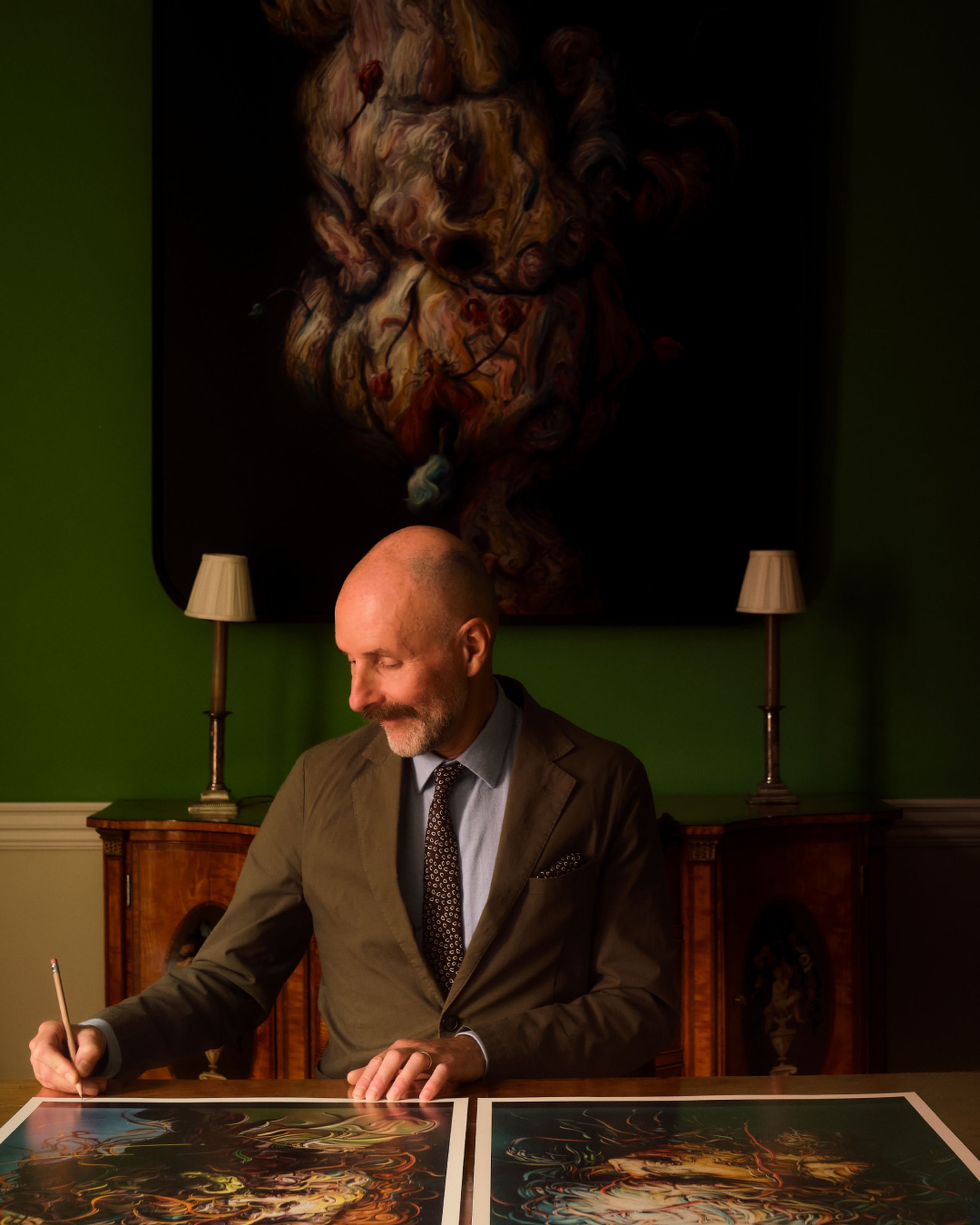 Glenn Brown signing a pair of new limited edition prints