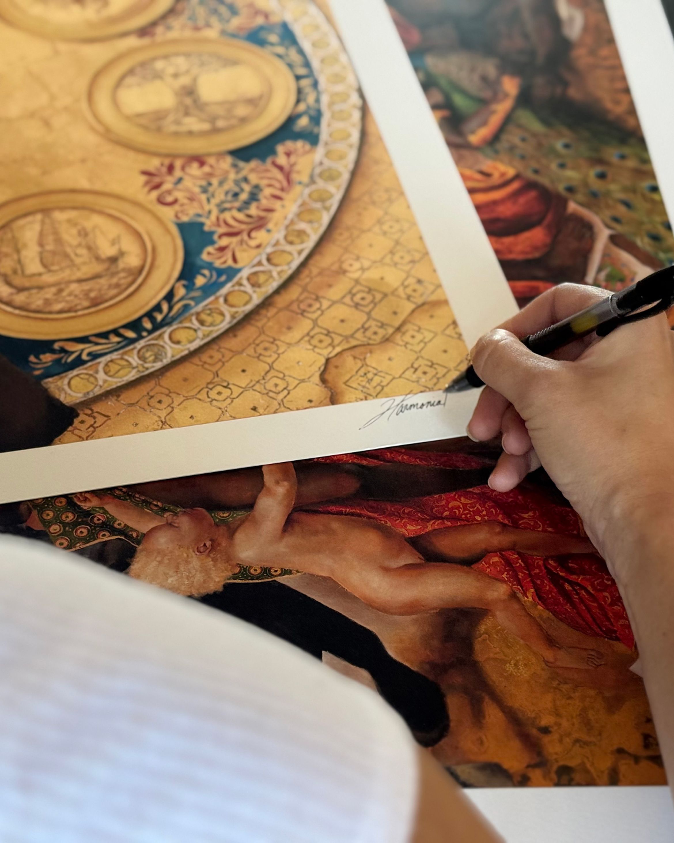 Harmonia Rosales signing her new limited edition print