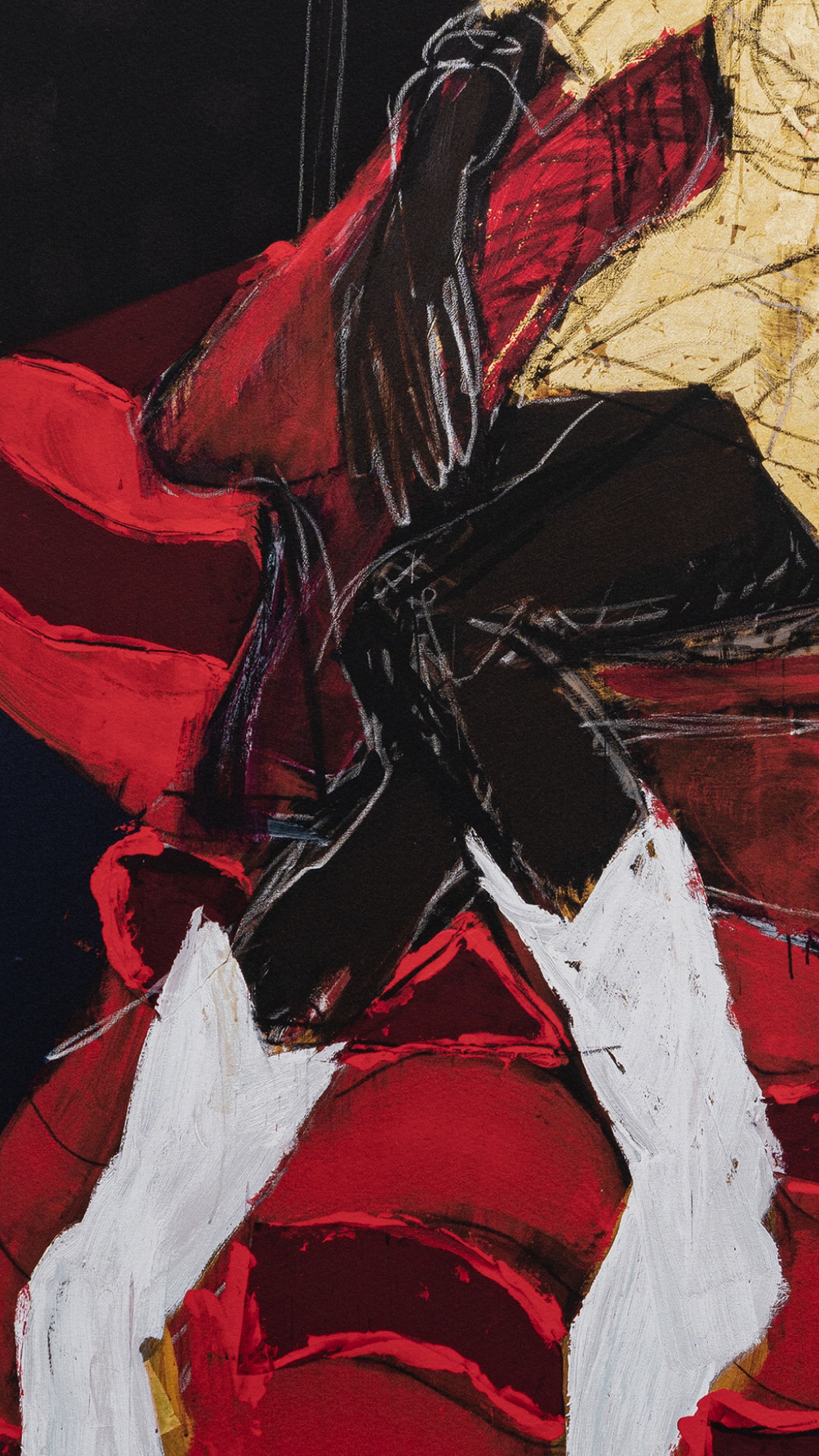 Close up of woman sitting in a dark room on red armchair, wearing white boots and a gold dress