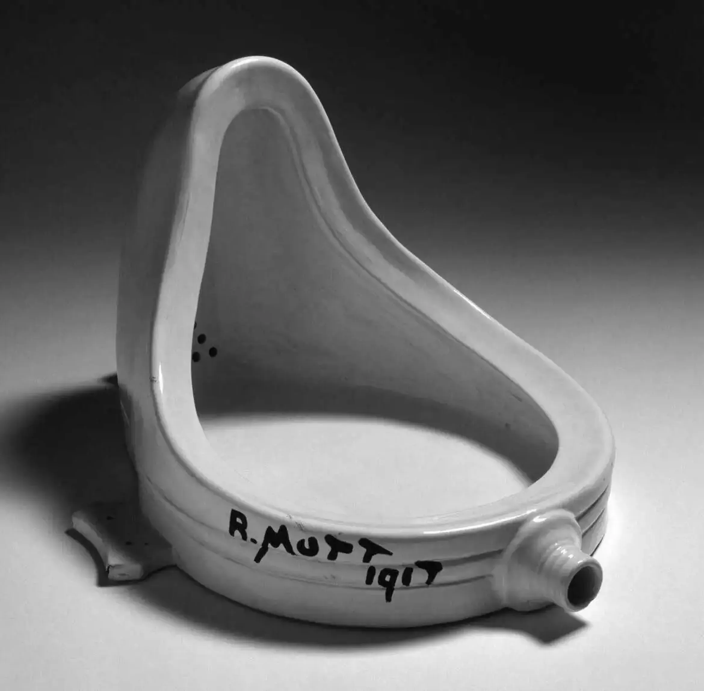 Ceramic urinal with graffiti