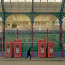 LUV skating past four red phone boxes LUV skating past four red phone boxes