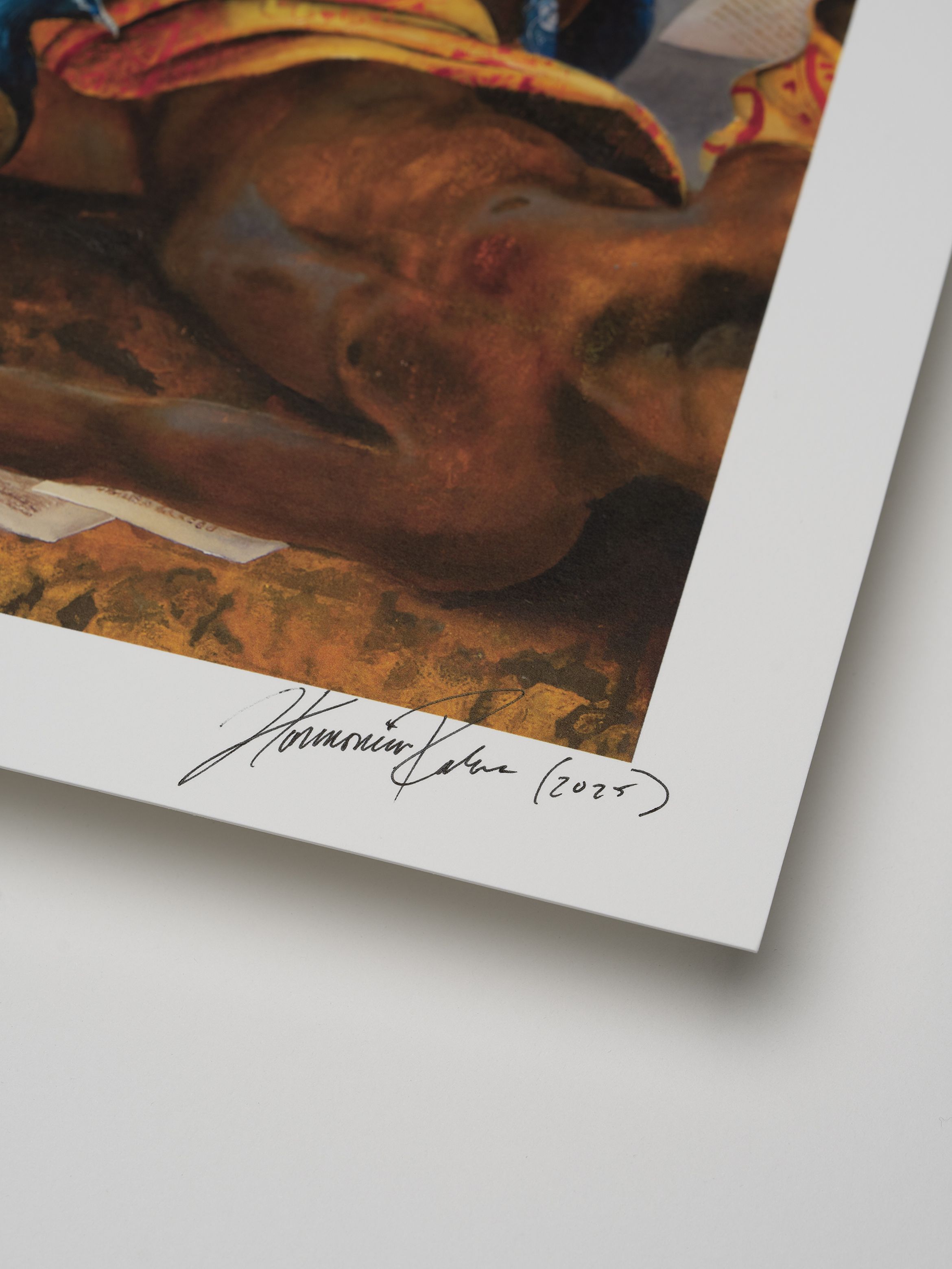 Close-up of a printed artwork corner featuring a signature and date "2023" on a white border, depicting a colorful, detailed painting.