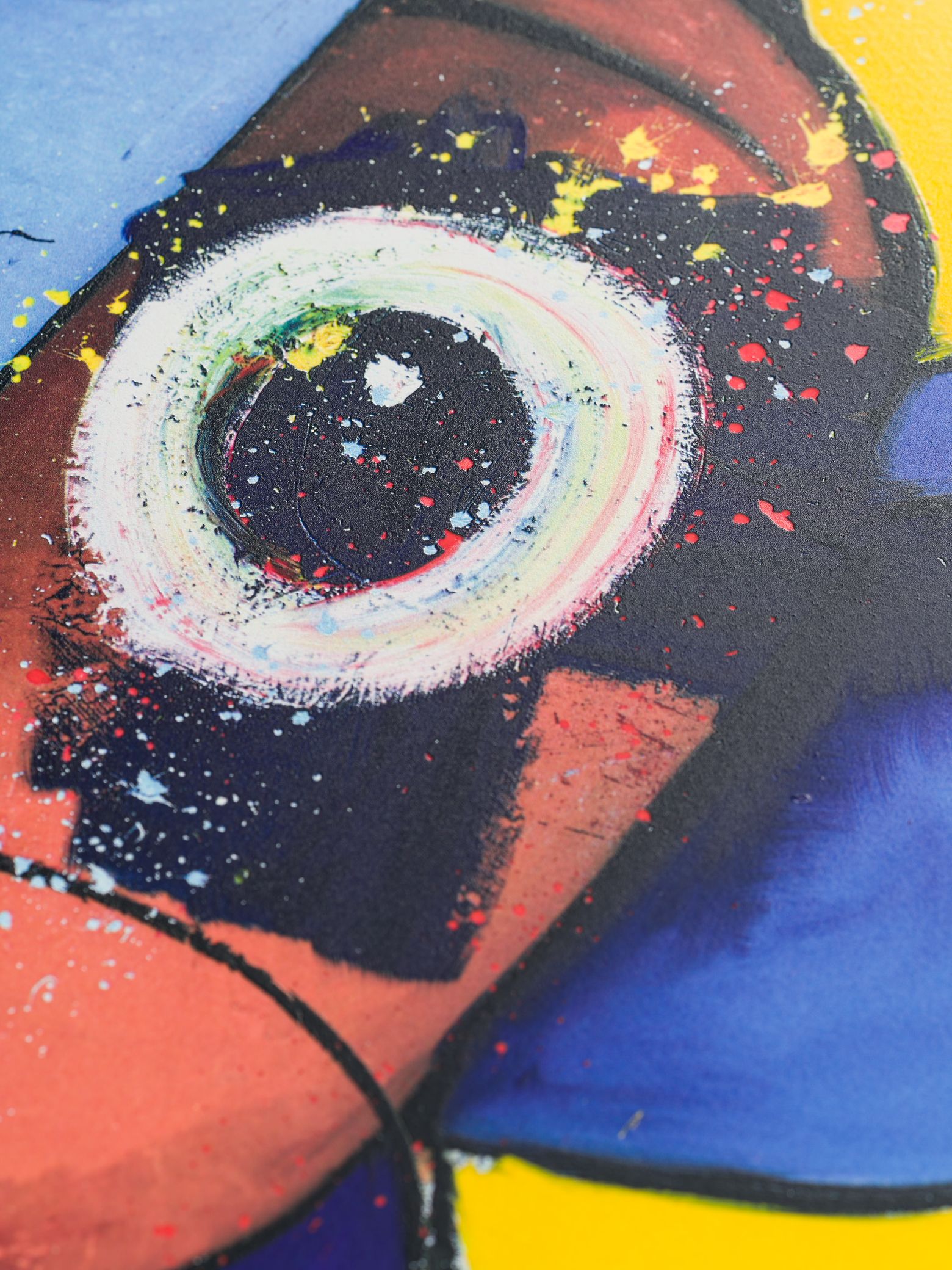 circular abstract white eye covered in paint splashes