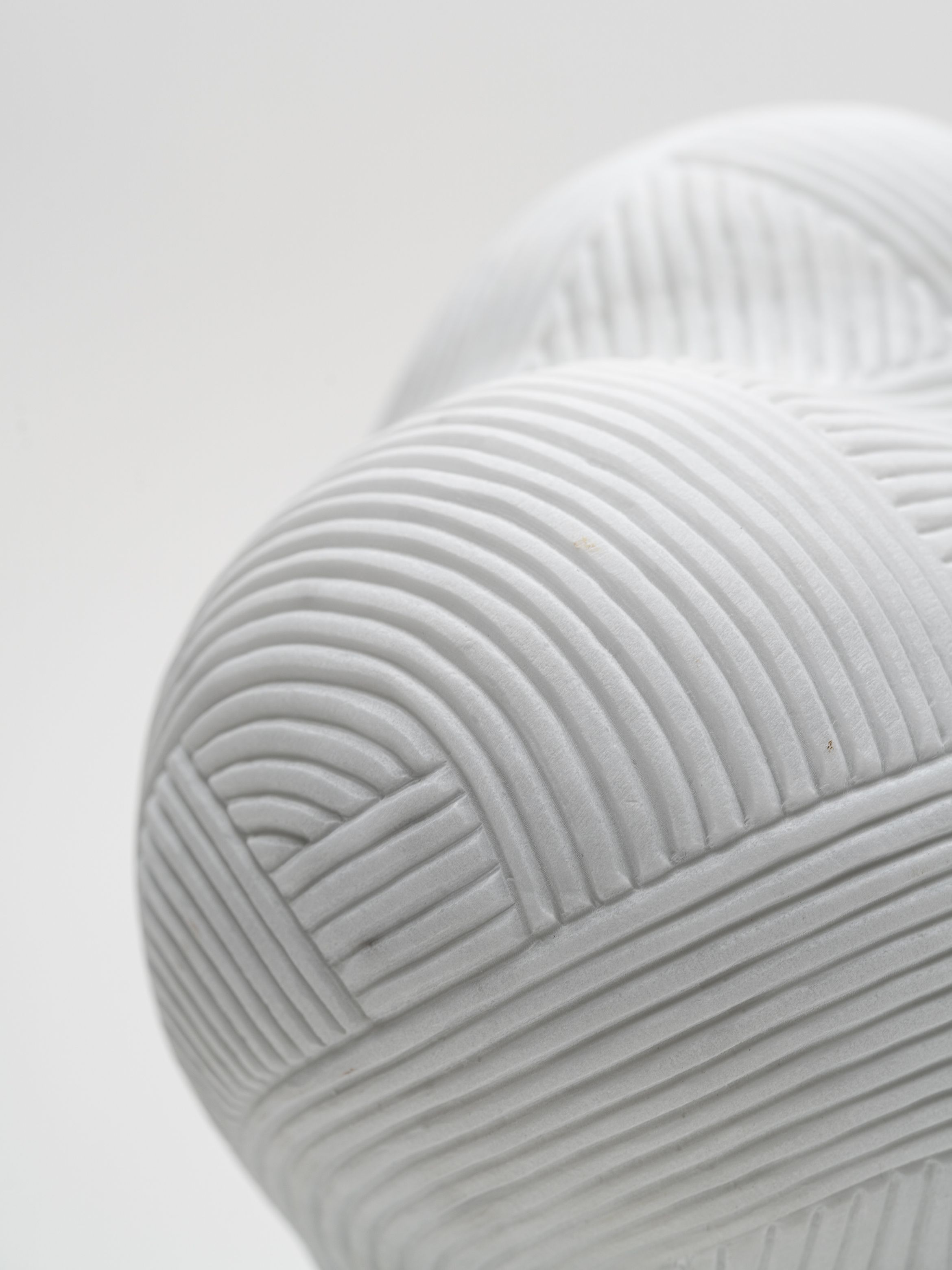 On-angle detail of a marble sculpture by En Iwamura.