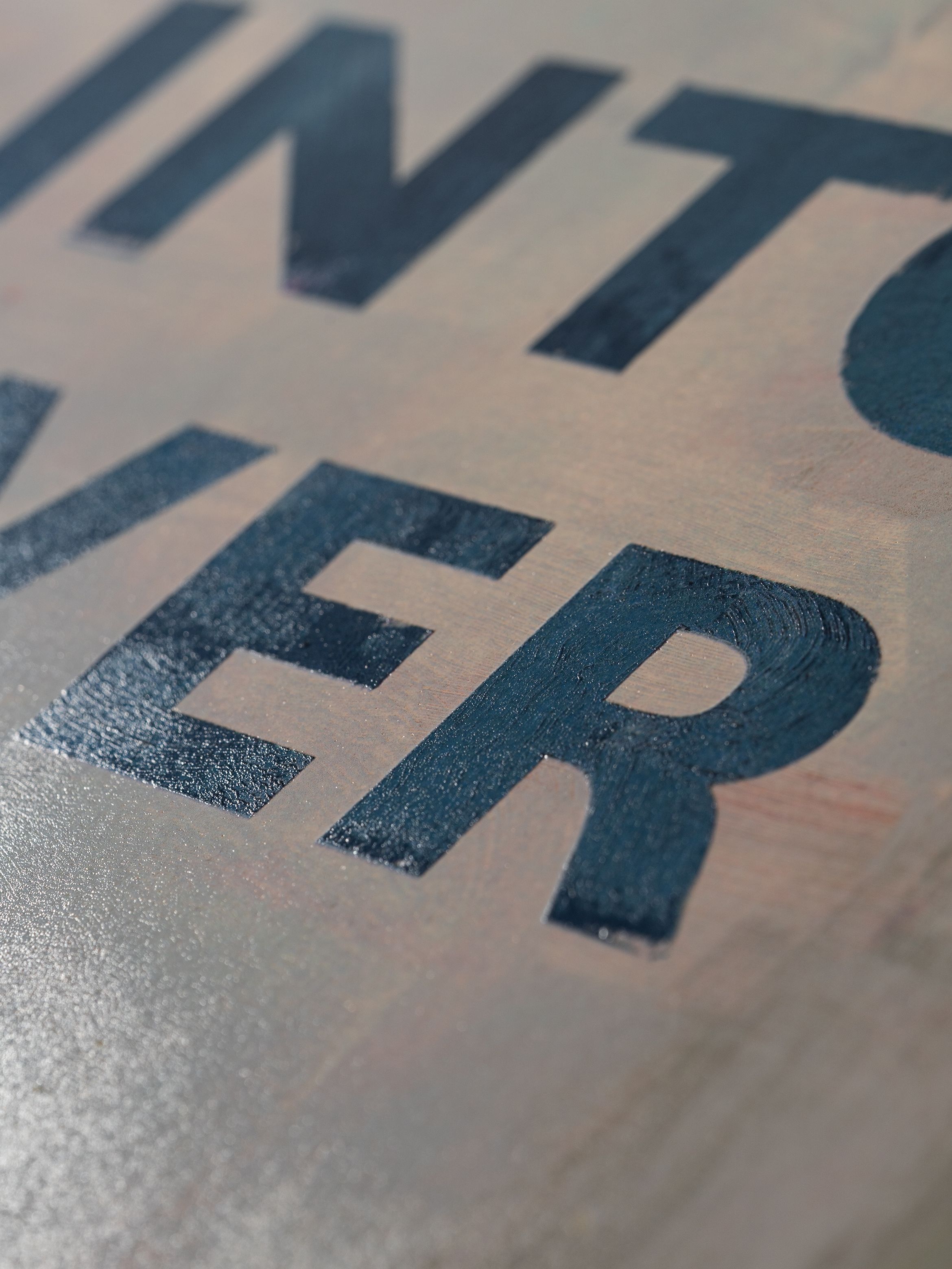 On-angle detail of a silkscreen print by Harland Miller.