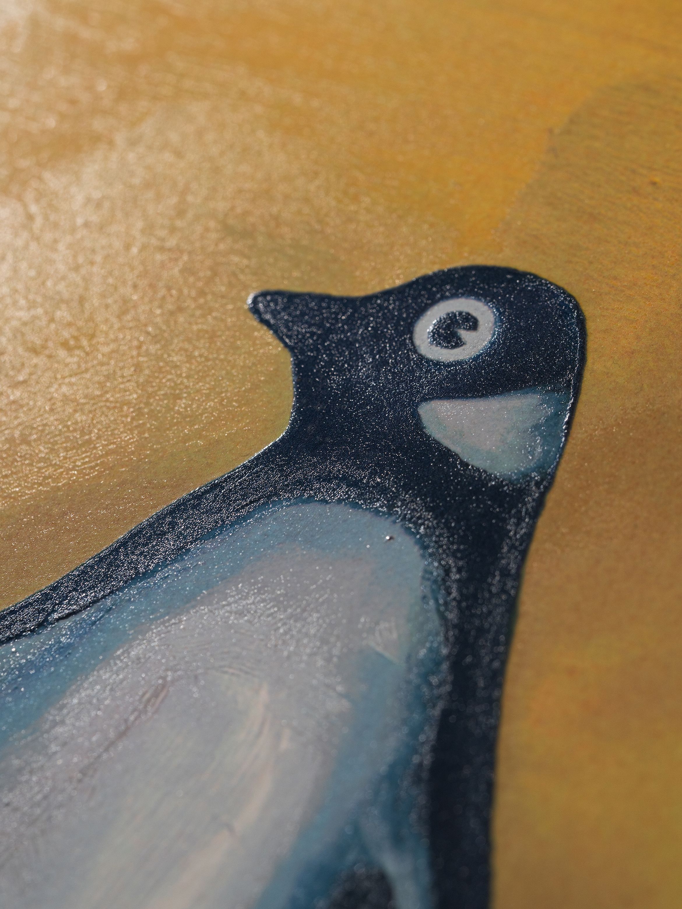 A closeup of Harland Miller's Penguin painting edition.