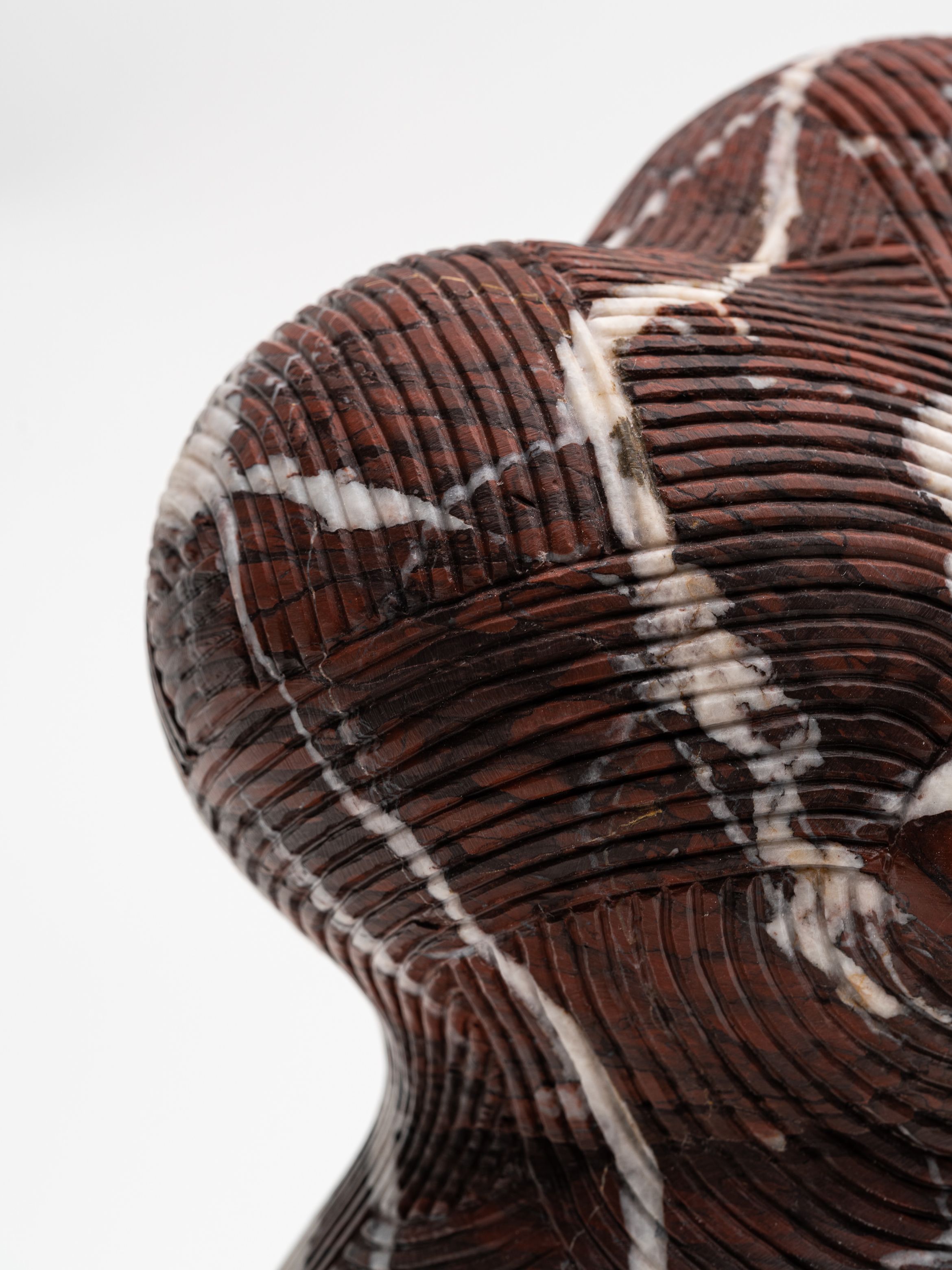On-angle detail of a marble sculpture by En Iwamura.