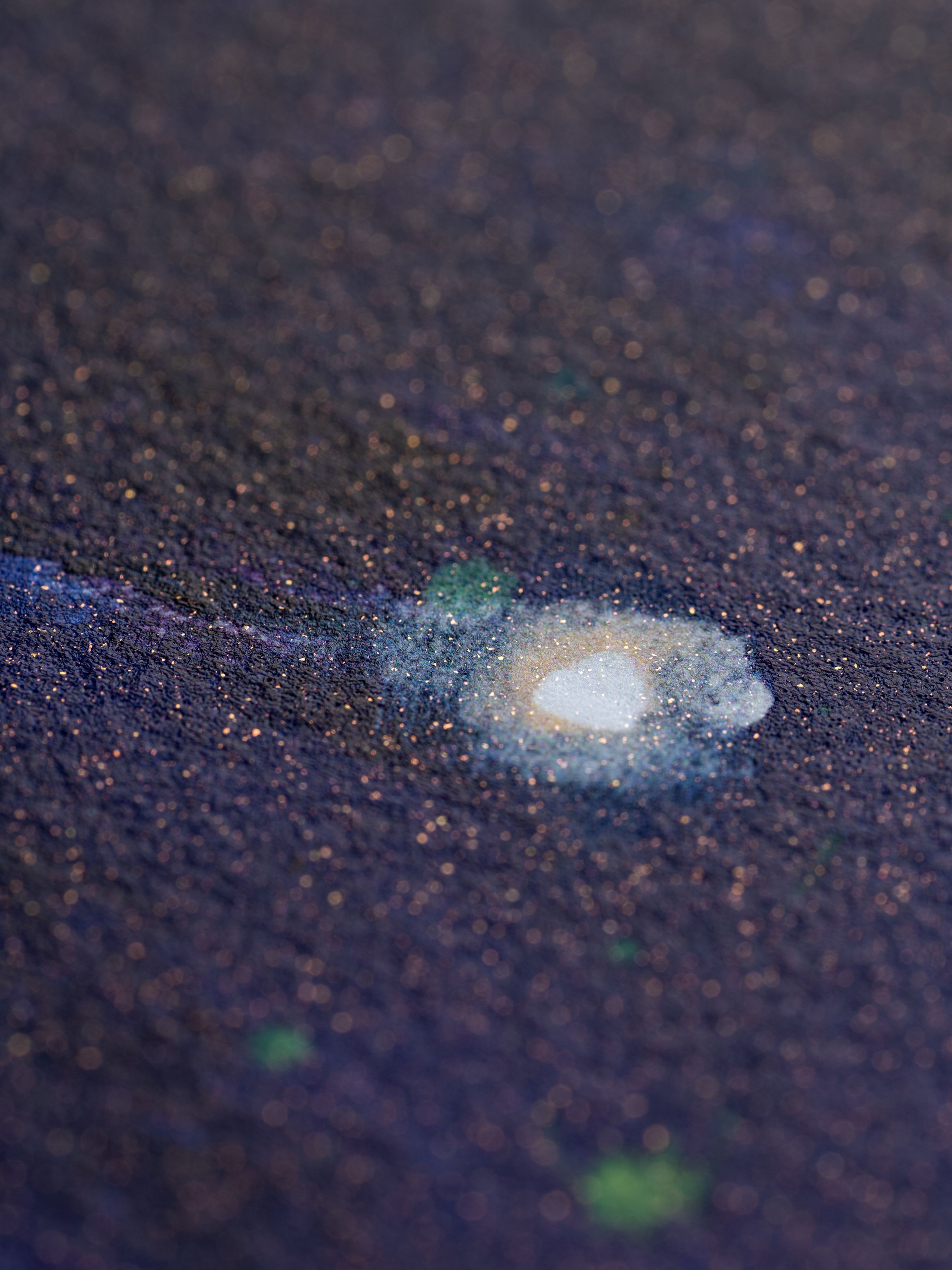On-angle detail of an UV pigment print by Katherine Bradford.