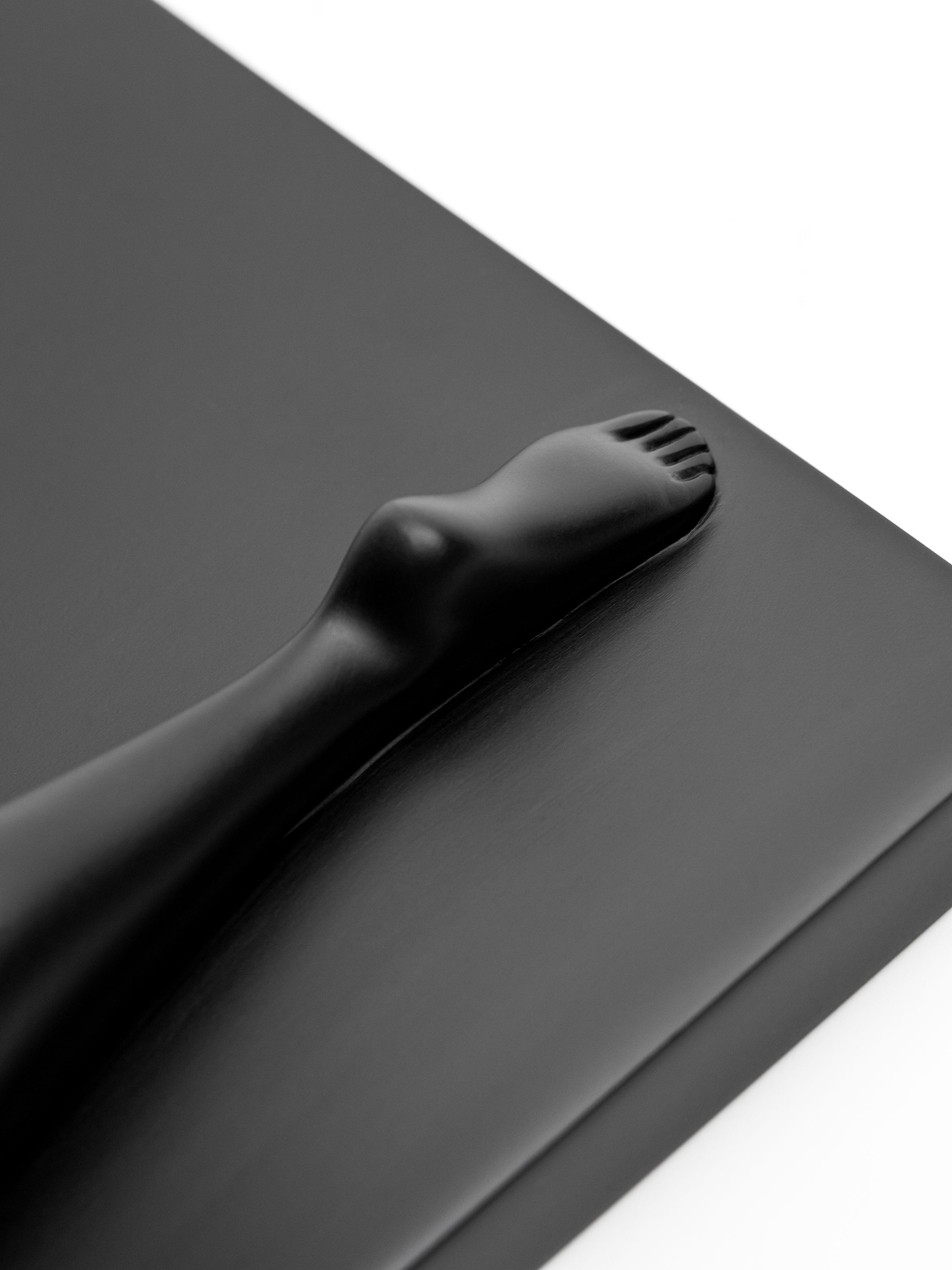 On-angle detail of a resin cast sculpture by Cleon Peterson.