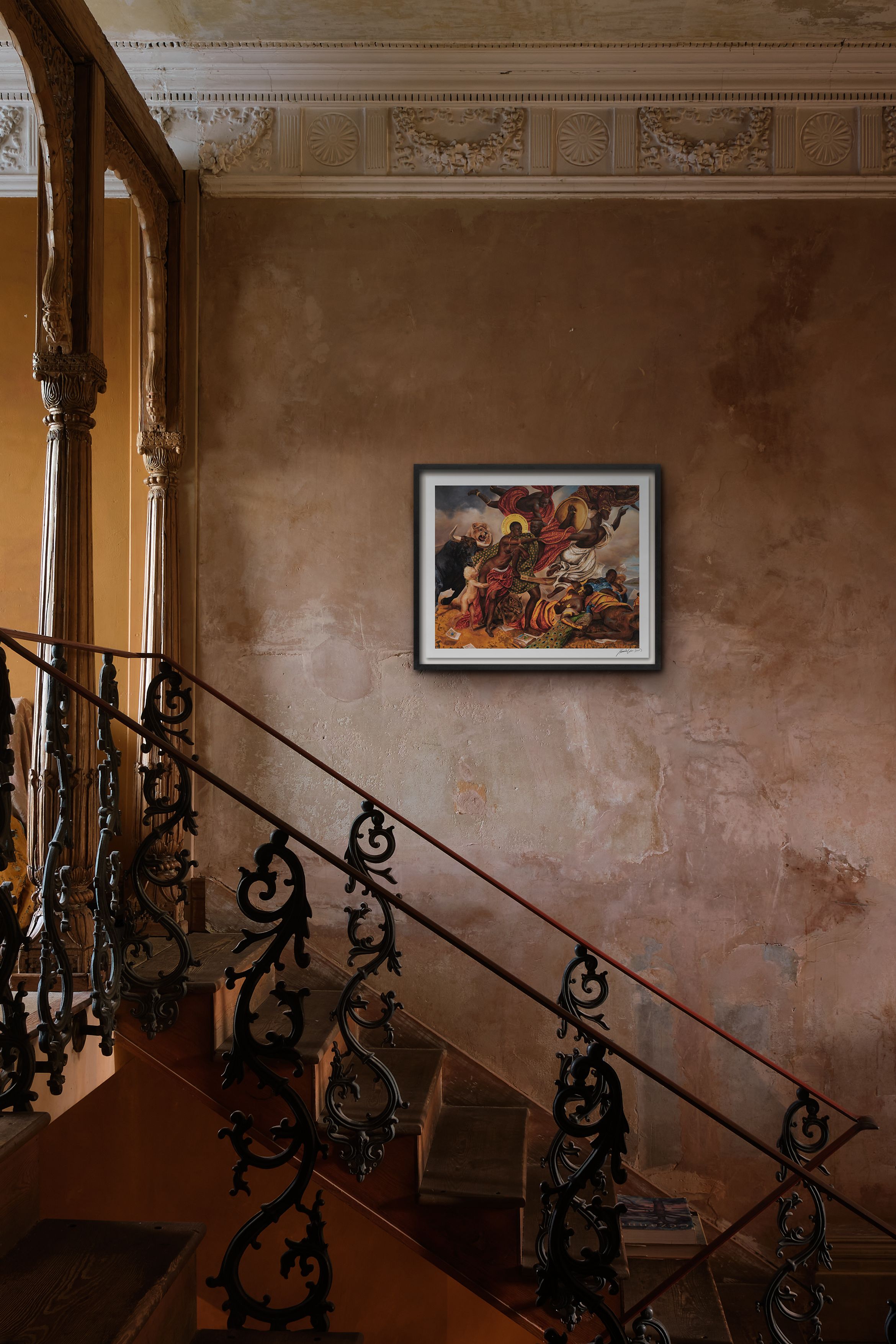 Ornate staircase with intricate railing, set against a textured wall featuring a framed painting. Elegant architectural details adorn the ceiling.