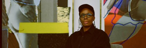 Mickalene Thomas seated in studio Mickalene Thomas seated in studio