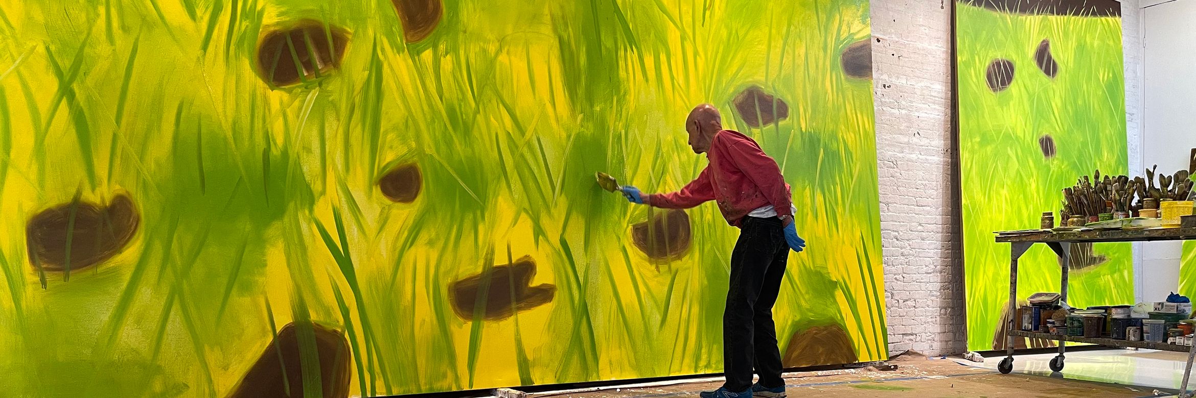 Alex Katz painting in his studio