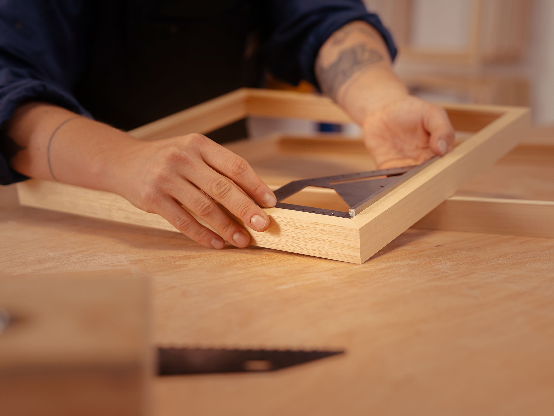 Close up detail of master framer Roos at work Close up detail of master framer Roos at work