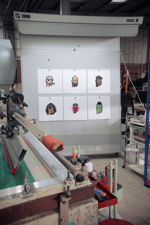 six cryptopunk prints laid out in make-ready print studio six cryptopunk prints laid out in make-ready print studio