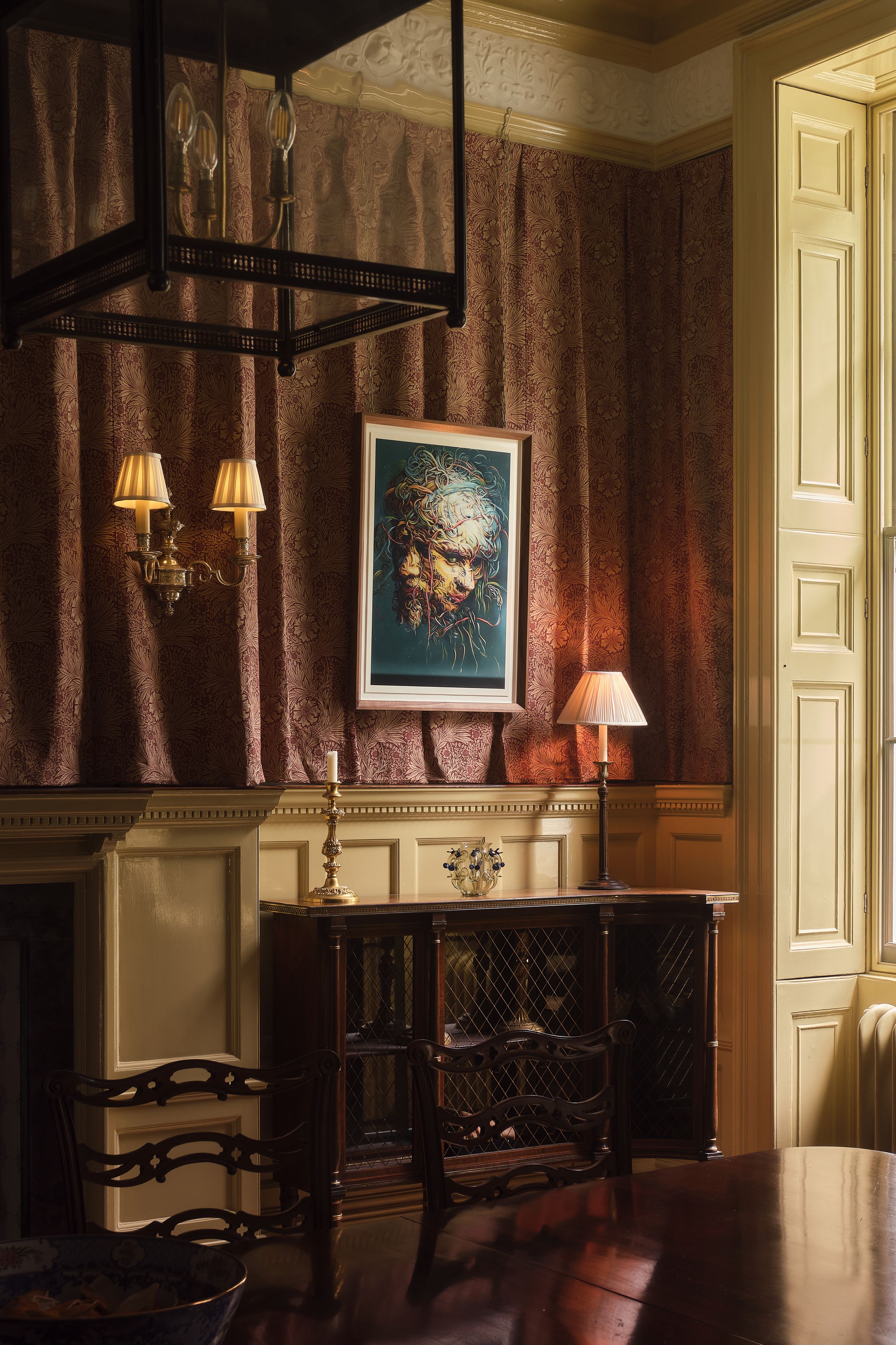An archival pigment print by Glenn Brown hung in the artist's home, framed in a walnut frame.