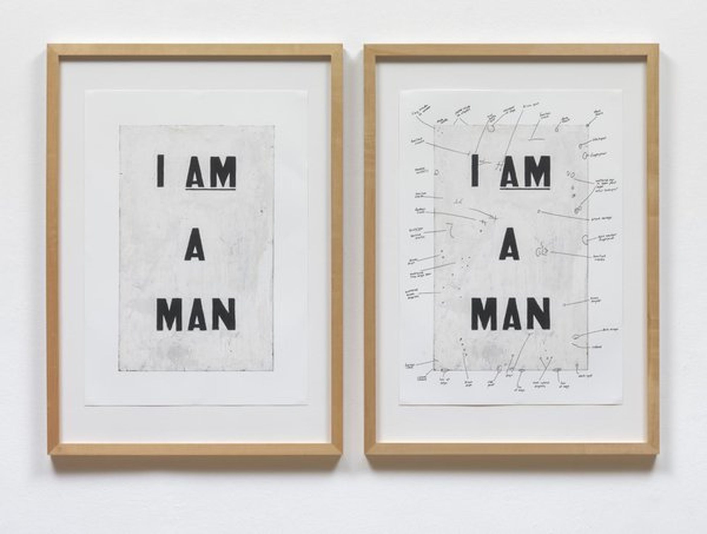 Two framed artworks; left features bold "I AM A MAN," right has the same text with annotated details. Neutral background.