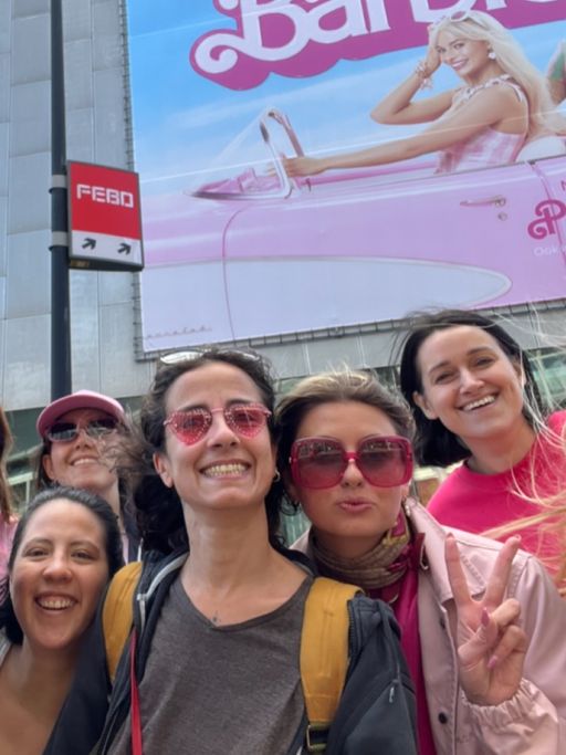 People standing in front of movie theatre People standing in front of movie theatre