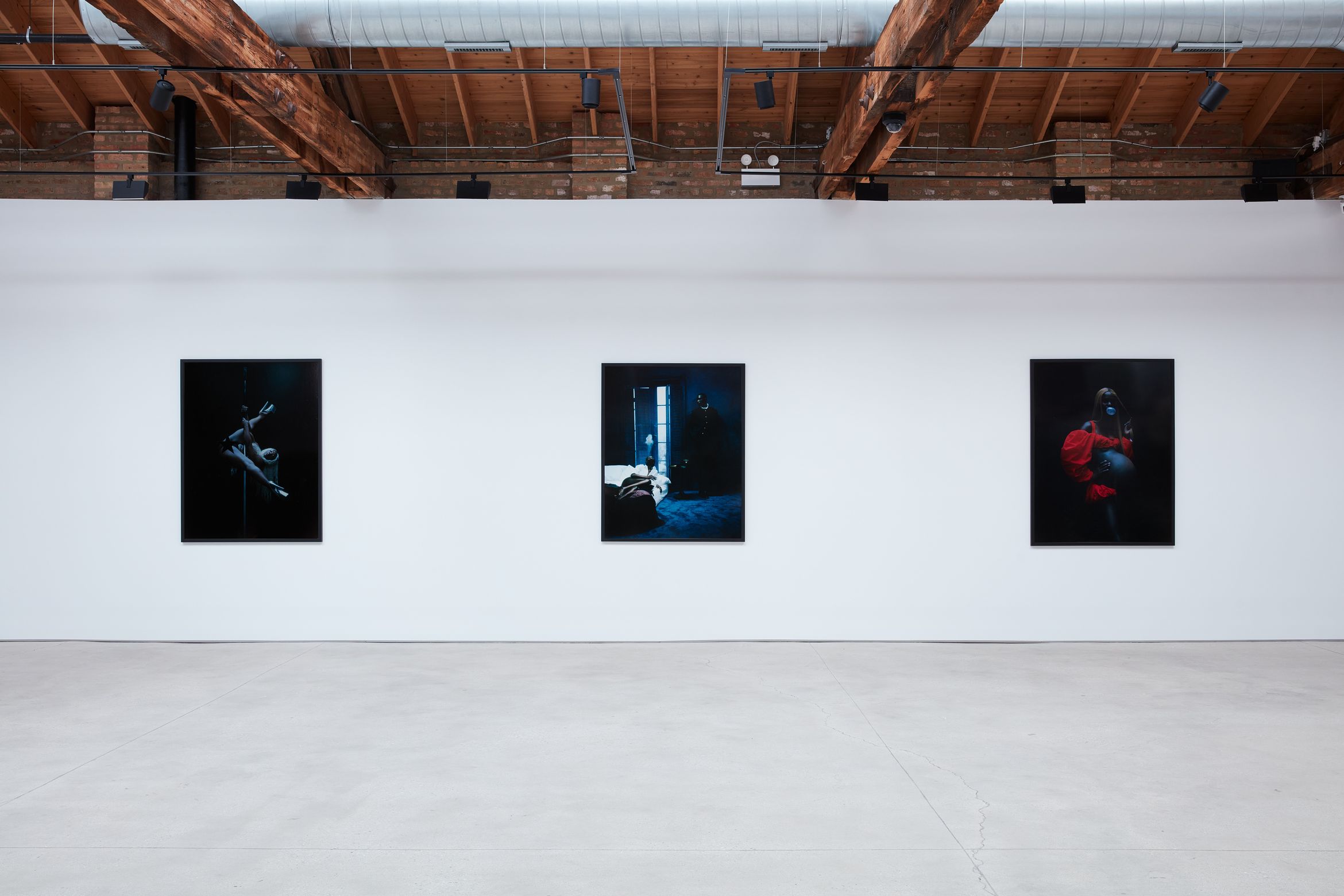 Trio of photographs by Gabriel Moses exhibited in gallery