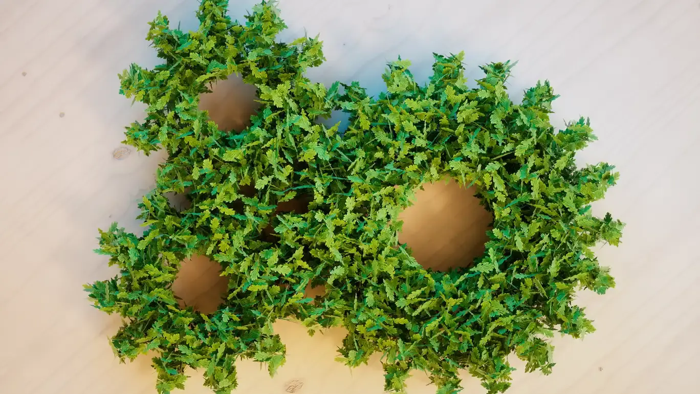 Three green wreaths with arranged to look like gears.