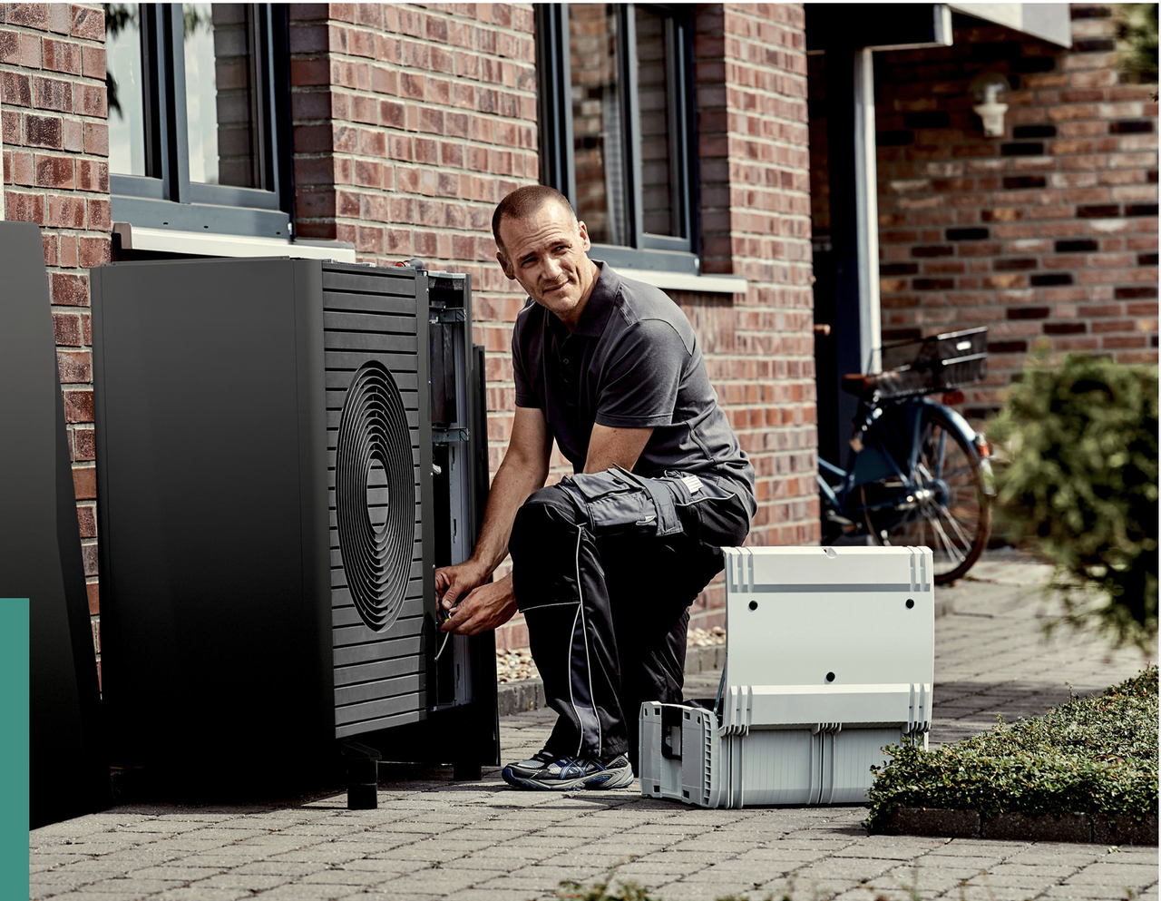 EPC engineer carrying out detailed servicing on a Vaillant heat pump
