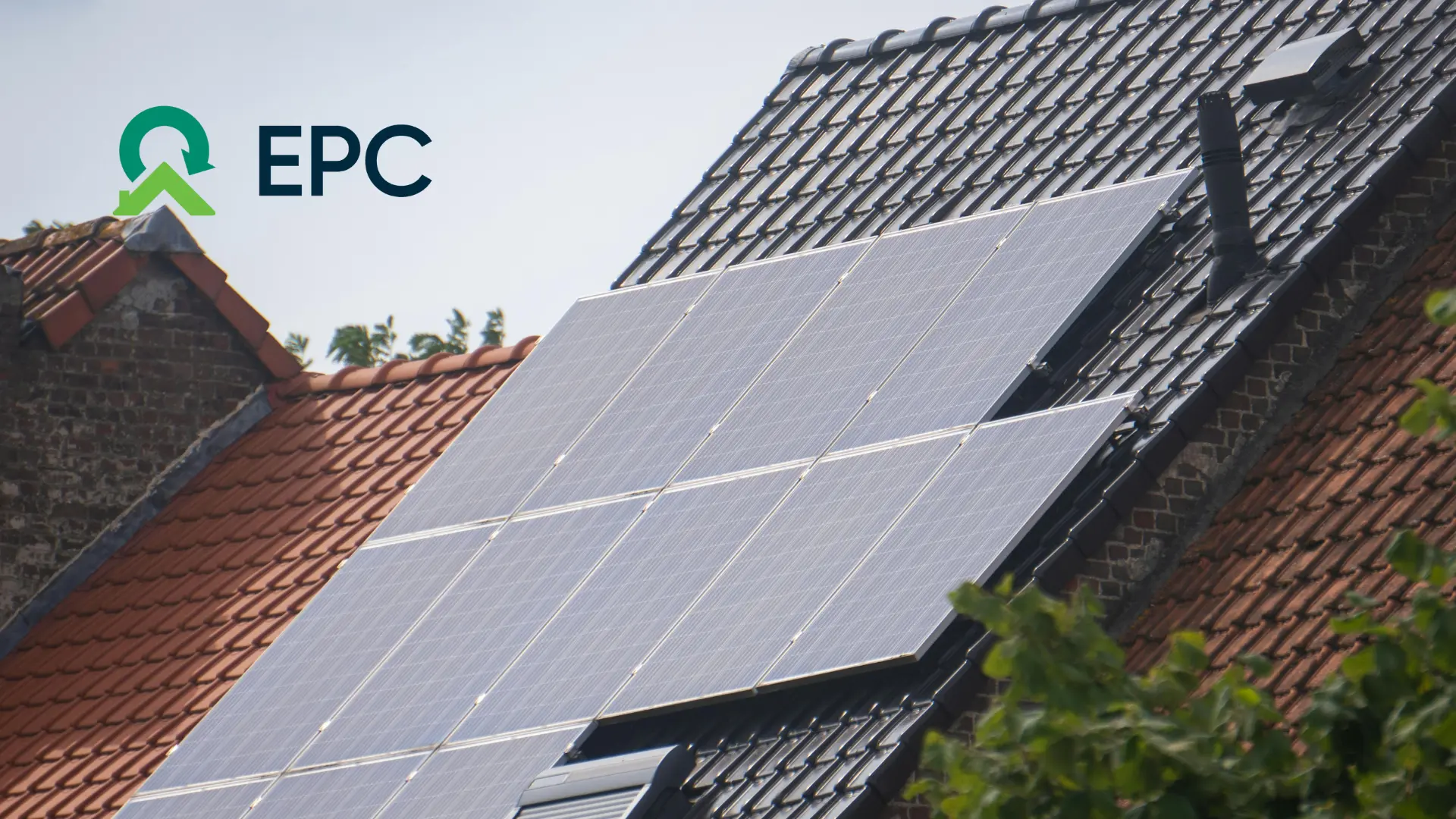 solar panels atop a roof on a grey cloudy day with EPC logo in top left