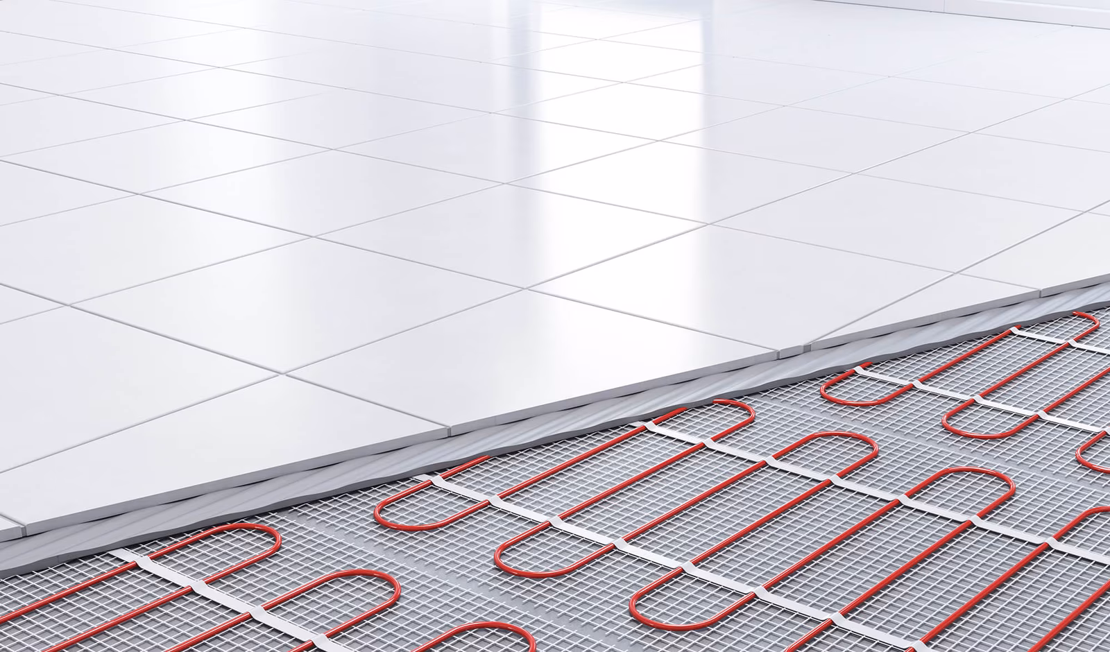 Cutaway view of a white tiled floor showing red underfloor heating pipes arranged in a grid pattern beneath the tiles.