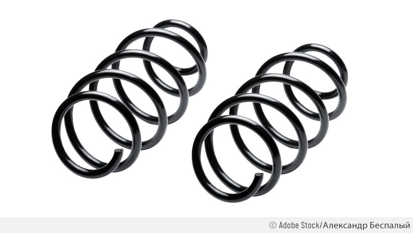 Deux ressorts de suspension noirs sur fond blanc