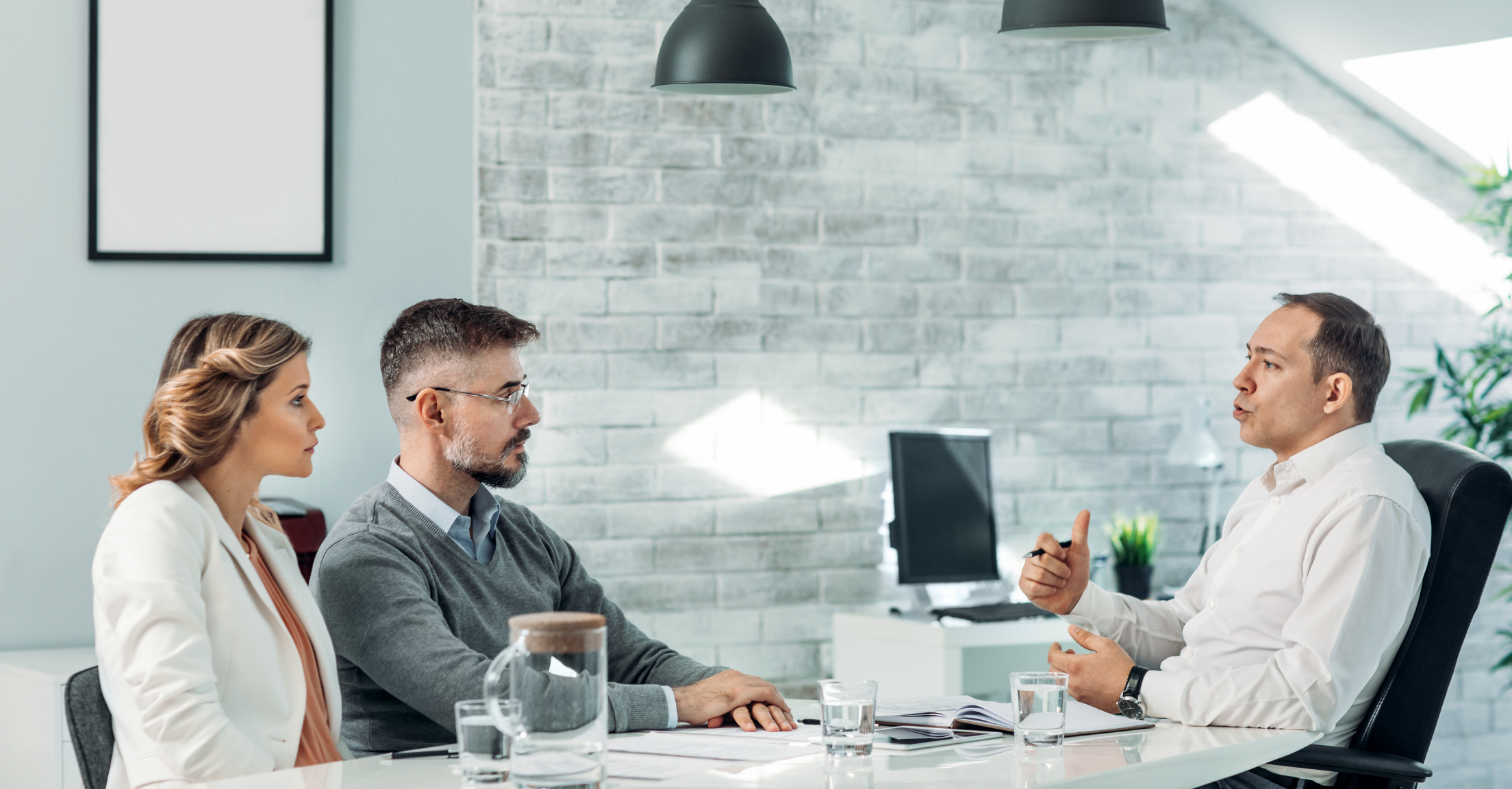 Financial advisor meeting with couple in an office