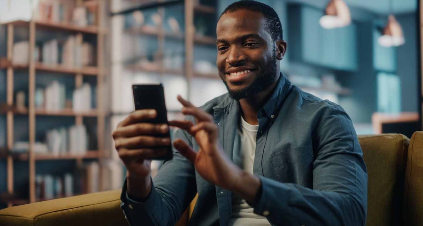 Guest holding a mobile phone to place order