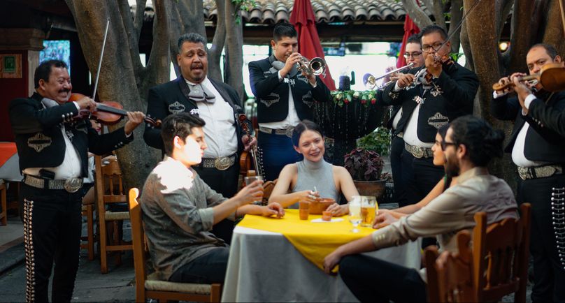 A group of musicians serenade guests