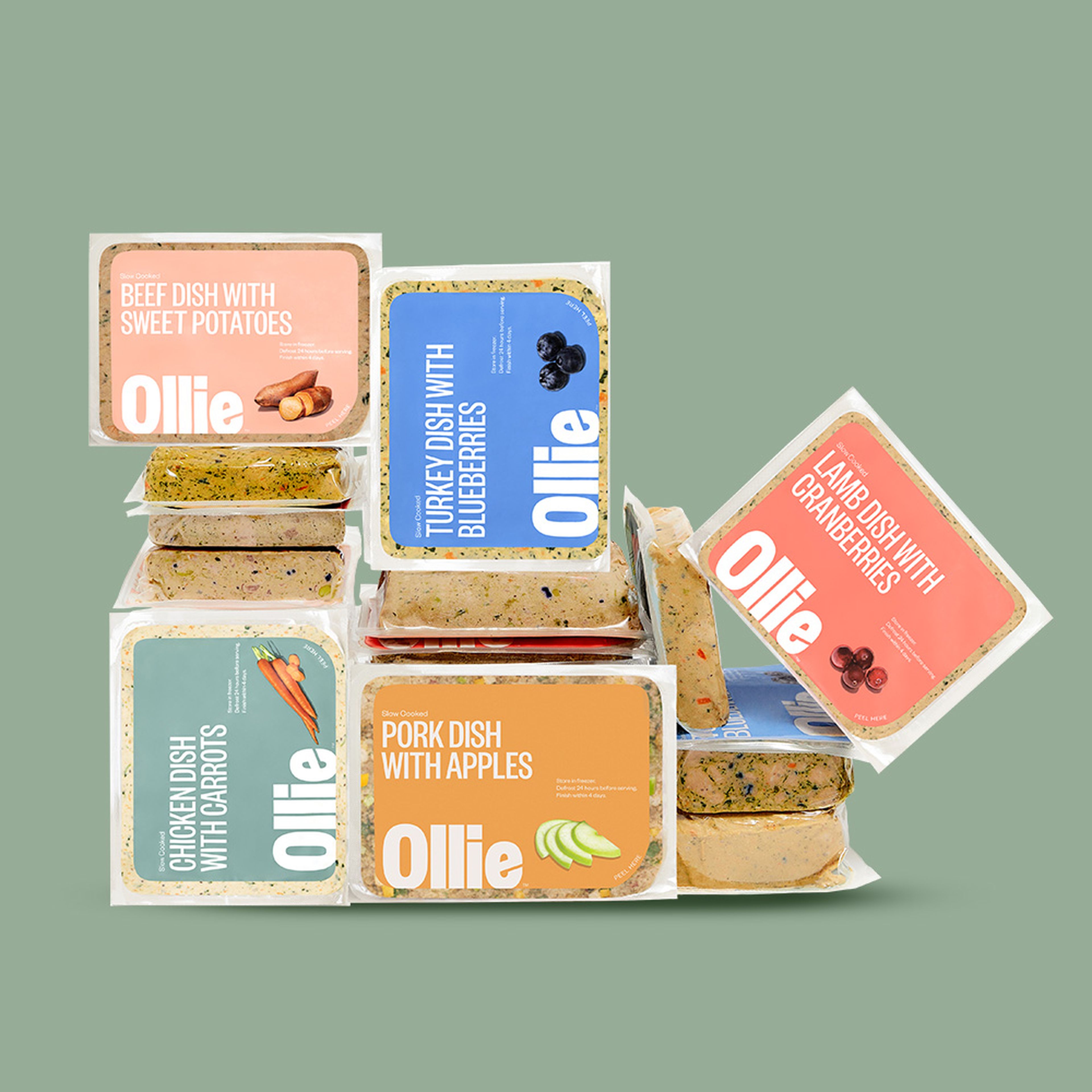 All of Ollie's five fresh dog food recipes in a packs, stacked up.