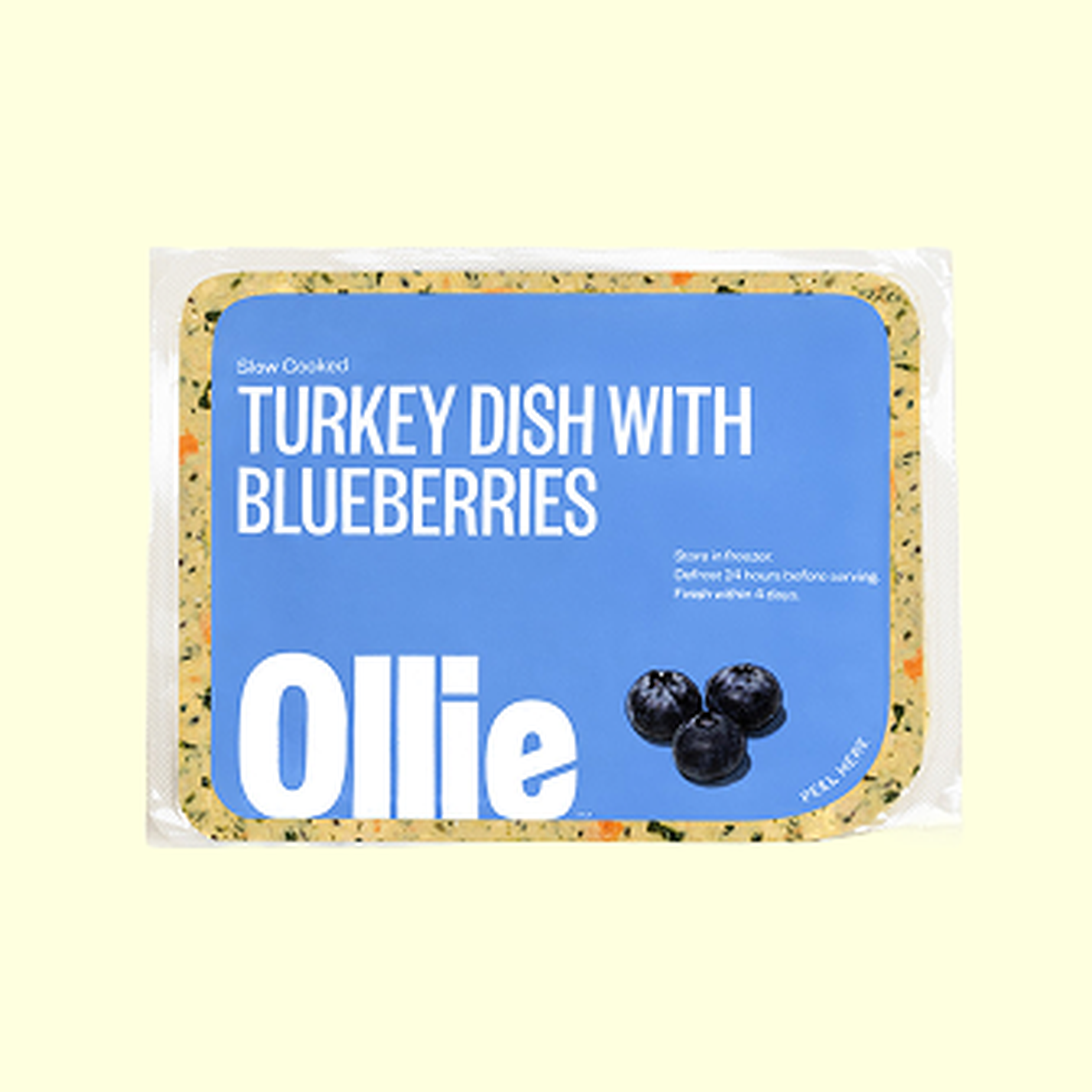 A packaged turkey dish with blueberries by Ollie, featuring cooking instructions and images of blueberries on a blue background.