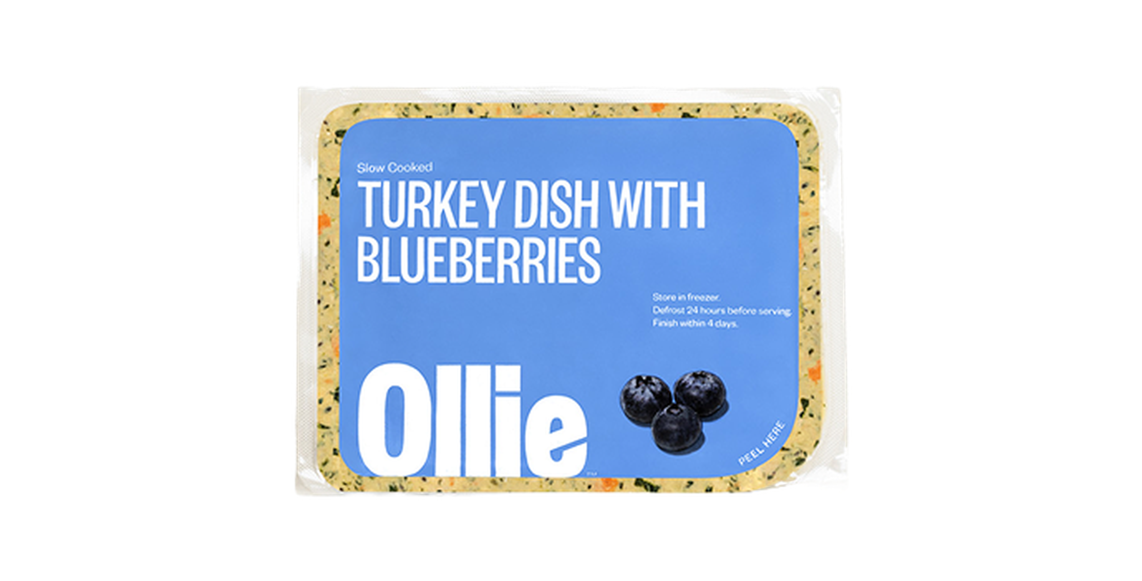 Packaged Ollie turkey dish with blueberries, featuring a blue label with storage instructions.