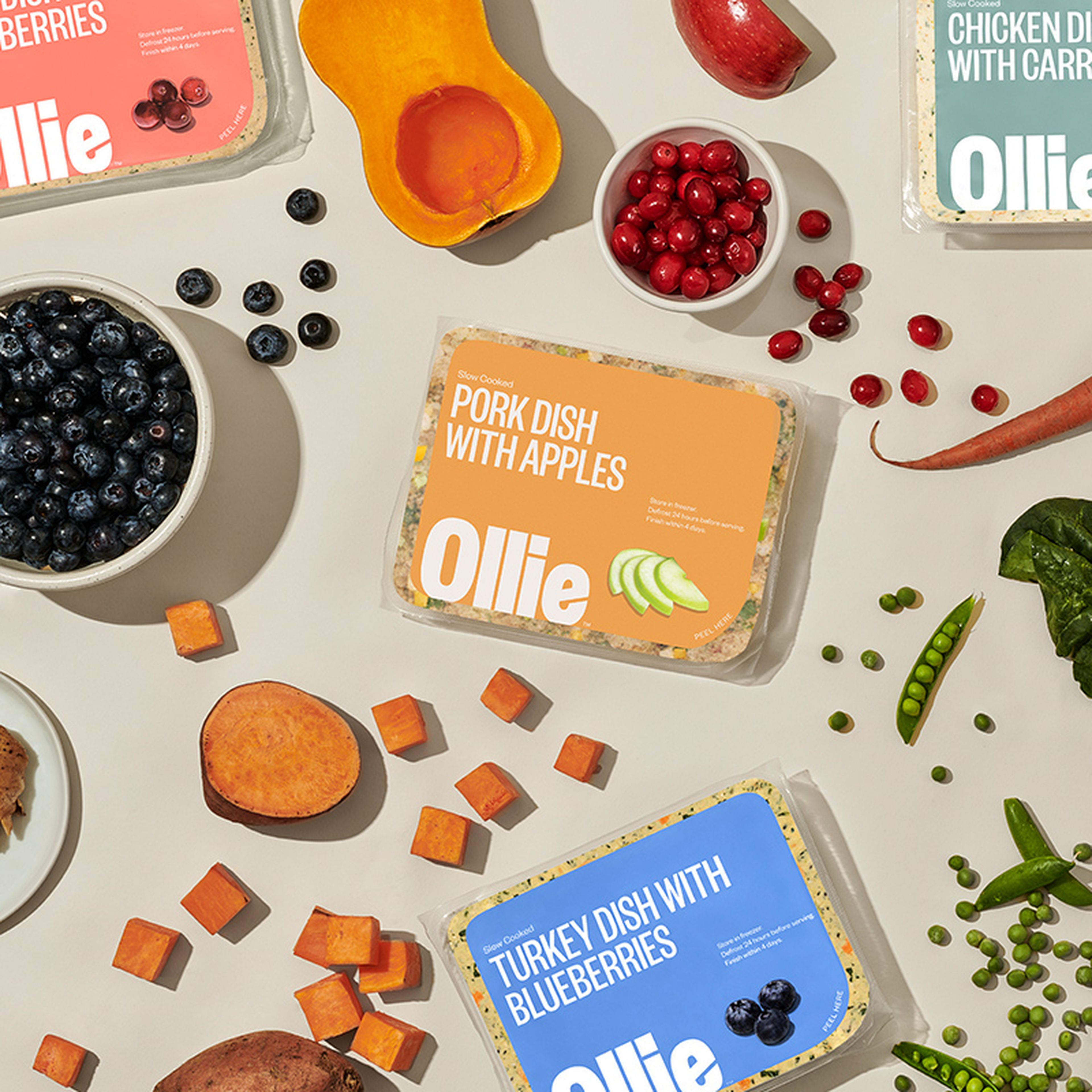 Fresh Ollie packs with fresh ingredients around it.