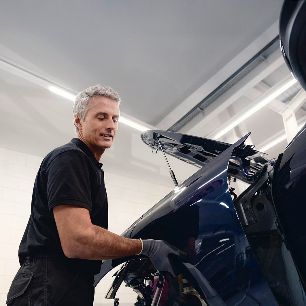 A man working on an Audi
