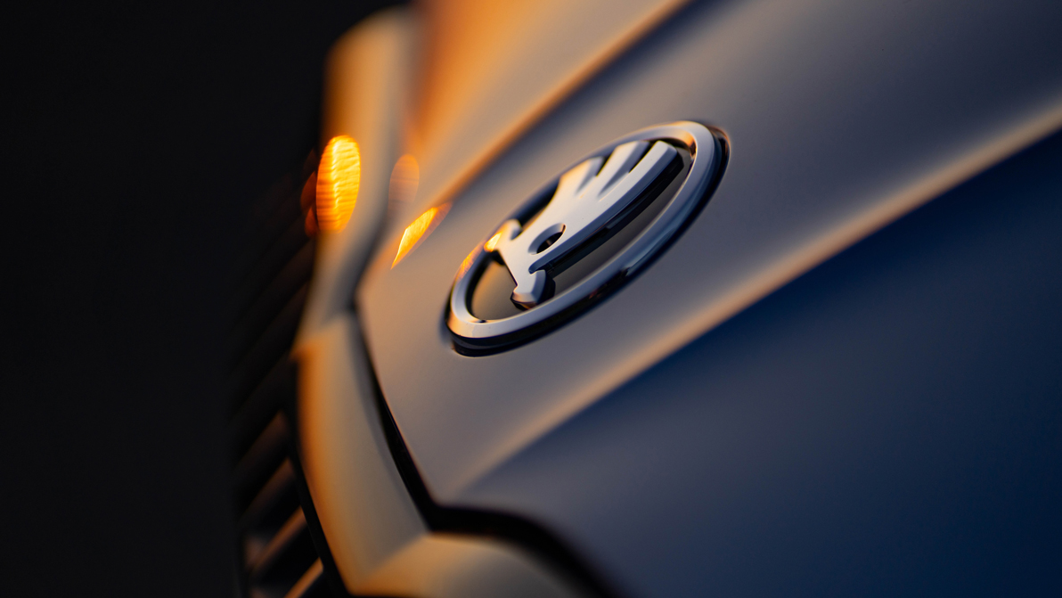 Skoda badge in the sunset