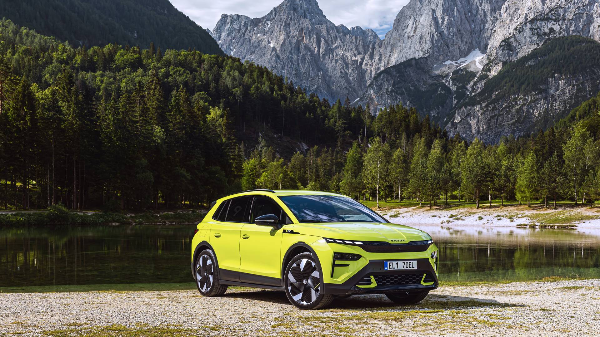 Elroq vRS in neon yellow against a lake and a mountian in the background