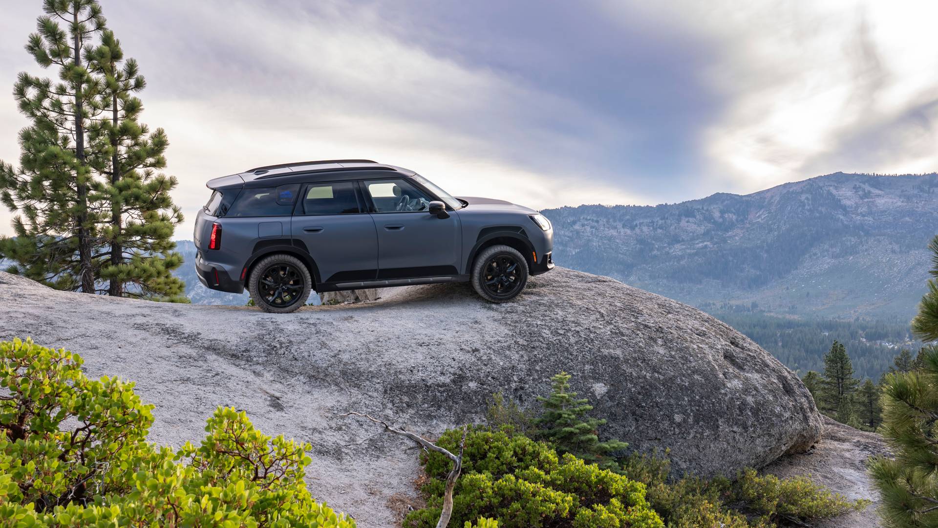 MINI Countryman Untamed Edition on the edge of a cliff overlooking mountains