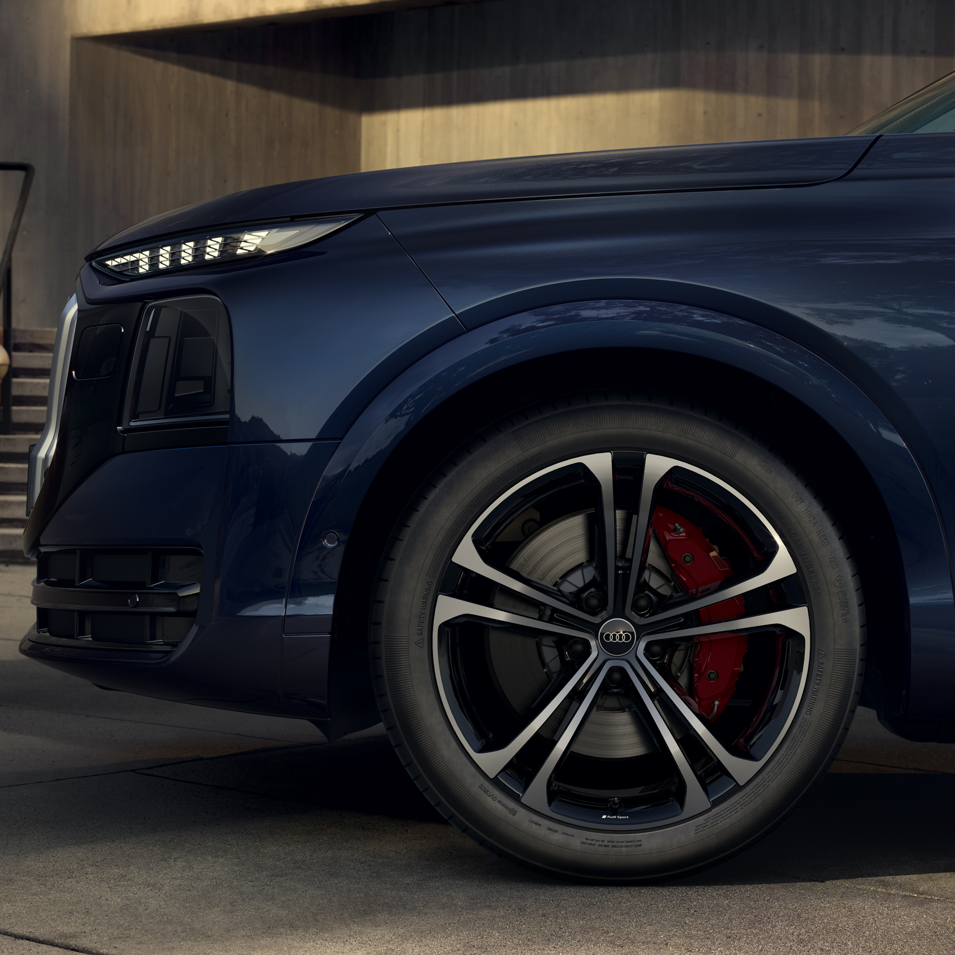 q9-trim-2 A close up of the front alloy wheel of the Audi Q9