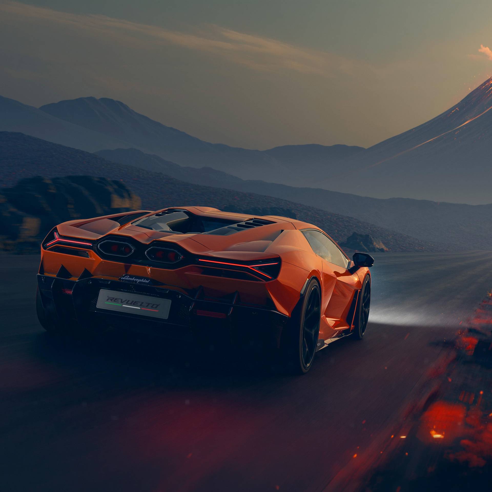 Lamborghini Revuelto in orange driving toward a volcano